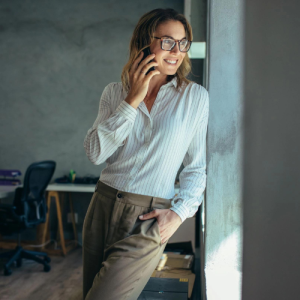 attorney on phone standing against wall