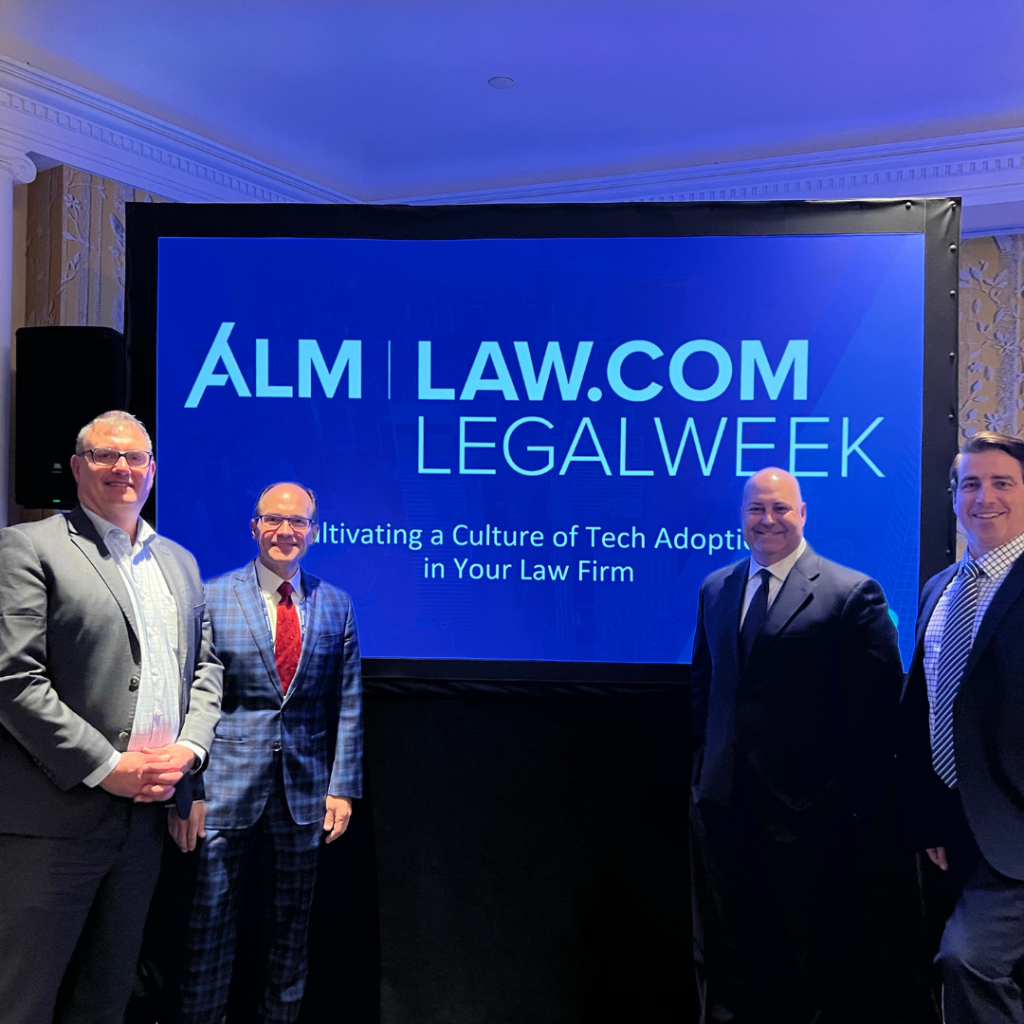 Legalweek - team standing in front of presentation screen